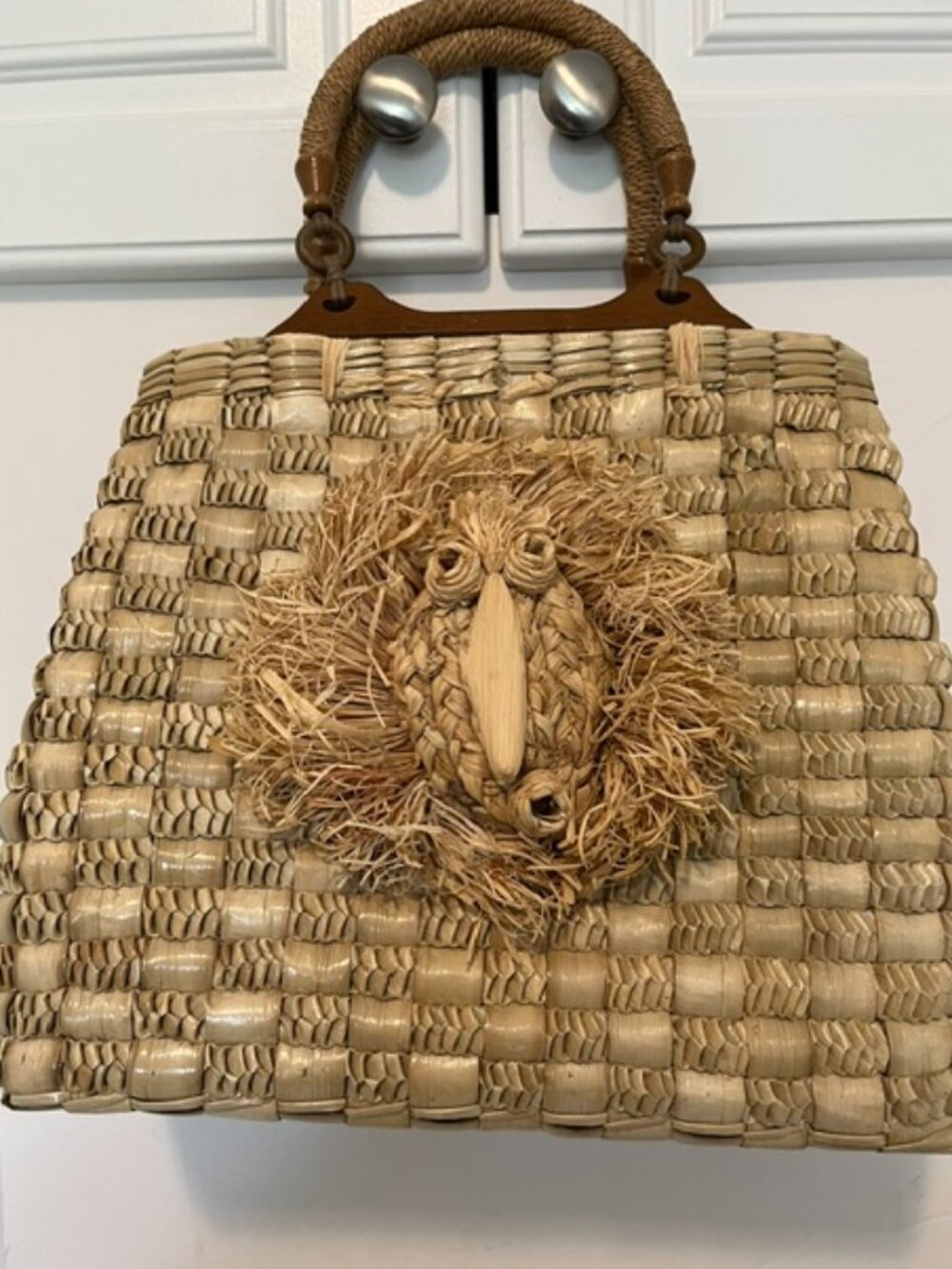 Vintage woven basket w raffia bird decal.